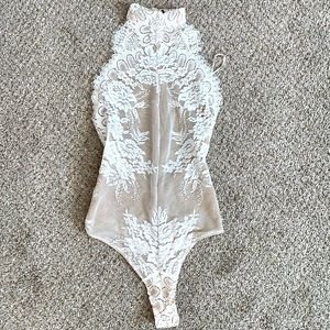 White laced backless body suit